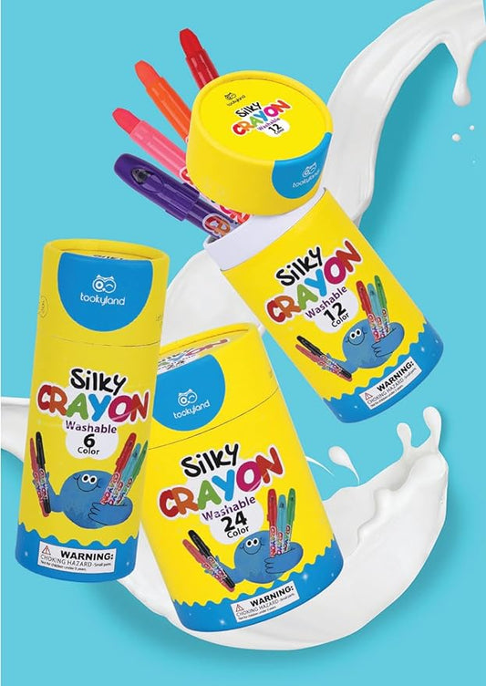 Picture showing three boxes of Tookyland Silky Crayon of 6, 12 and 24 colors. The background is blue sky. The crayon box is yellow with Tookyland brand logo. 